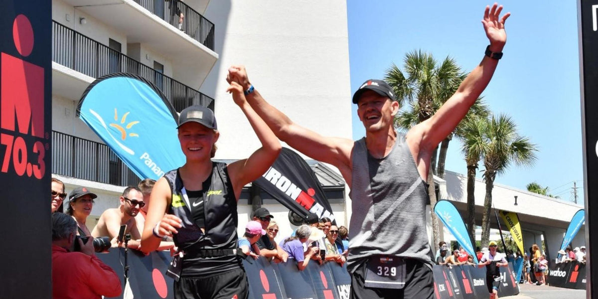 Father and Daughter crossing finish line