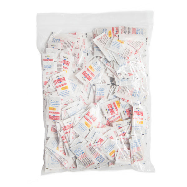A clear bag displays a bulk quantity of individual serving packets of Redmond Real Salt. 
