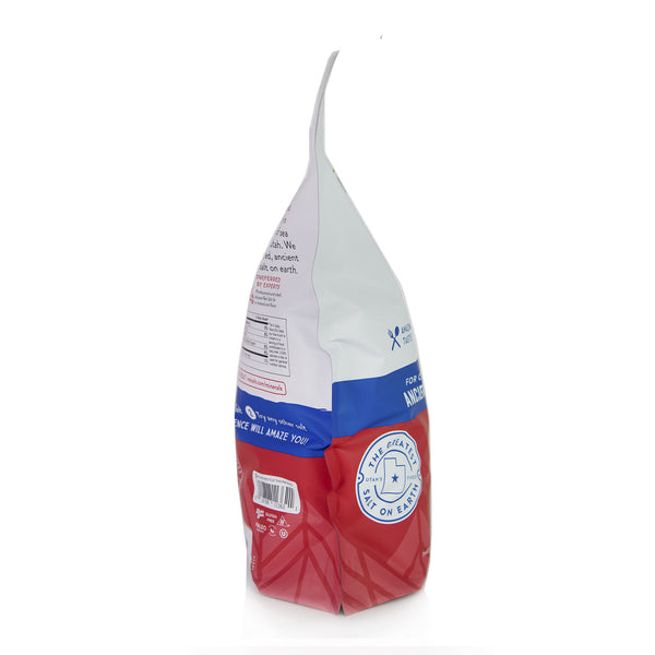 Red and white bag of The Greatest Salt On Earth ancient sea salt stands against a white background. 
