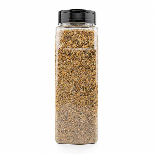 A clear plastic spice jar filled with Redmond's Real Salt Organic Lemon Pepper blend of dried herbs and spices.