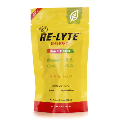 A bright yellow sample pack of Re-Lyte ENERGY stick packs stands upright against a white background. 
