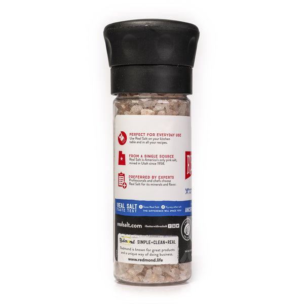 Clear grinder filled with coarse Redmond Real Salt, a single-source pink salt mined in Utah.